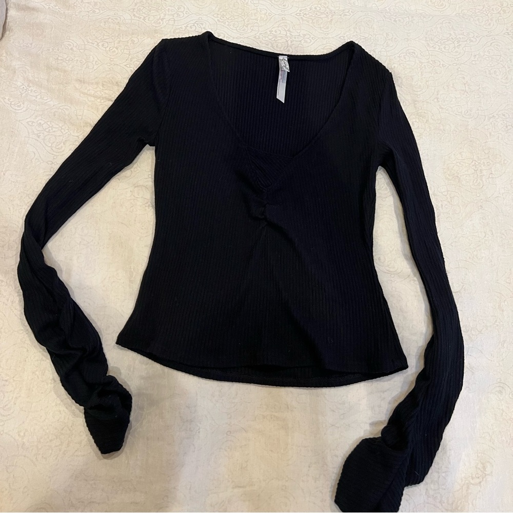 Free People Intimately ribbed sweater with ruched wrist detail.